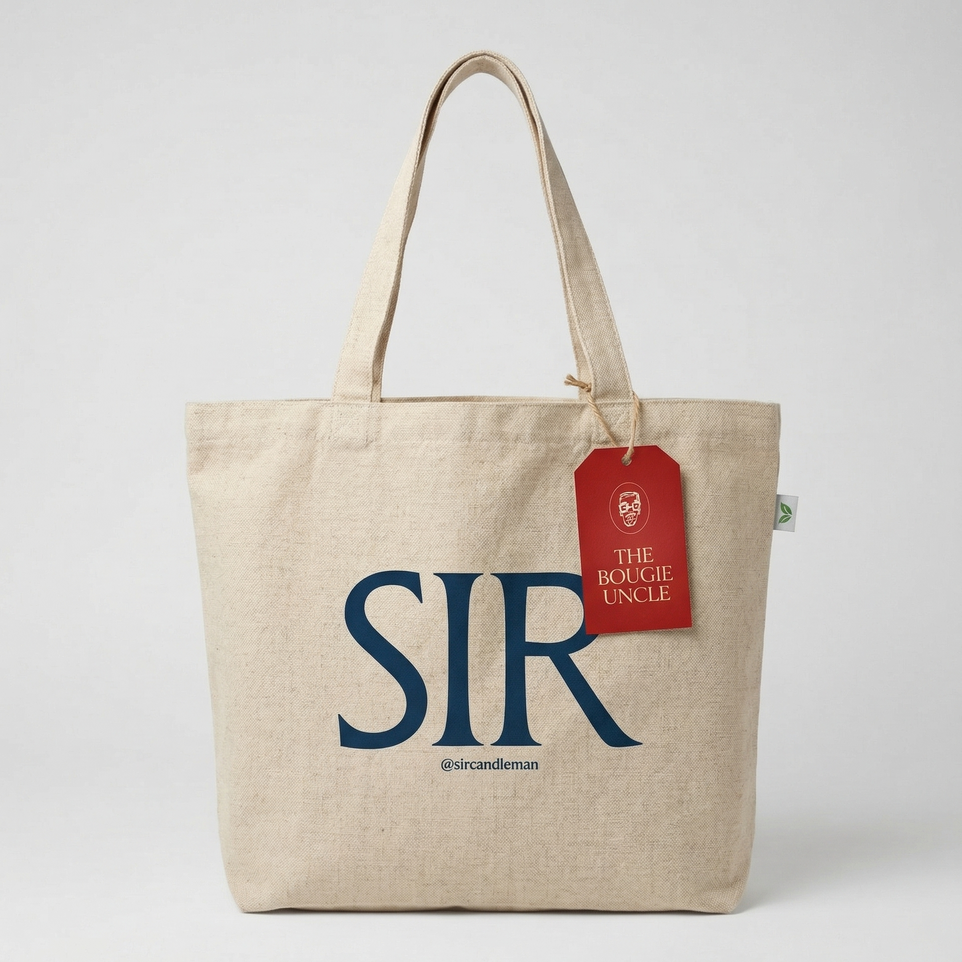 Beige tote bag with 'SIR' text and a red tag on a white background
